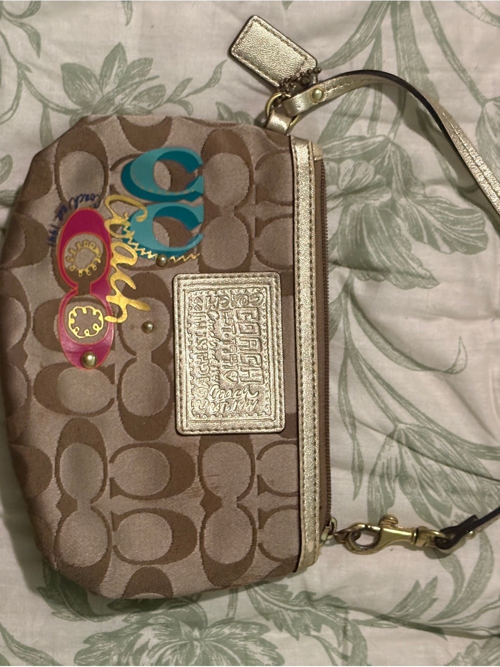 Coach Signature Canvas Wristlet with Metallic Gold Accents and Multicolored Logo
